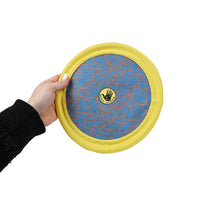 Carolina Pet Company Body Glove Tough Toss Disc shown in action during an outdoor fetch session with a dog.