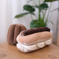 Lambwolf Collective Eclair snuffle toy showing textured cream-colored flaps and treat-dispensing pockets in detail.