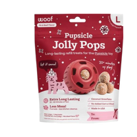 Woof brand Jolly Pops holiday dog treats displayed in festive seasonal packaging.