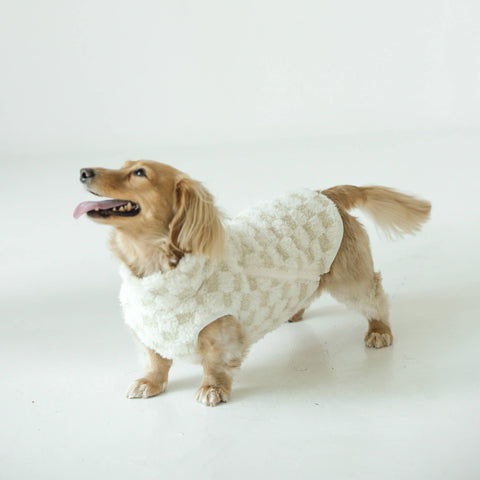 Lambwolf Collective Reversible Crosby Vest in cream featuring soft checkered fleece texture on a clean background.