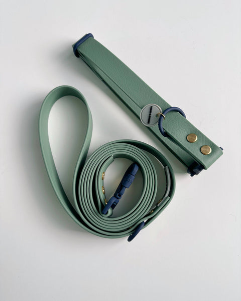 Hund & Shore Clover waterproof collar showing detailed view of green webbing and metal hardware construction.