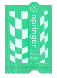Springland poop bag dispenser shown with waste bag roll inserted, demonstrating compact size and portable design.