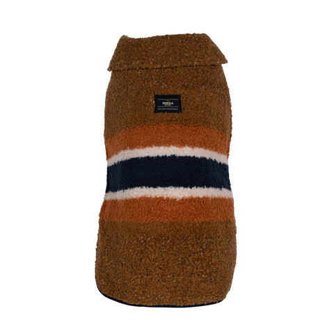 Shinola Pet brown barn-style dog coat showing adjustable straps and reversible shearling lining detail.