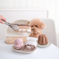 Lambwolf Collective Eclair snuffle toy showing textured cream-colored flaps and treat-dispensing pockets for dog enrichment.