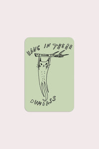 Close-up detail of Stay Home Club Hang in There sticker showing rounded rectangular shape and humorous motivational design.