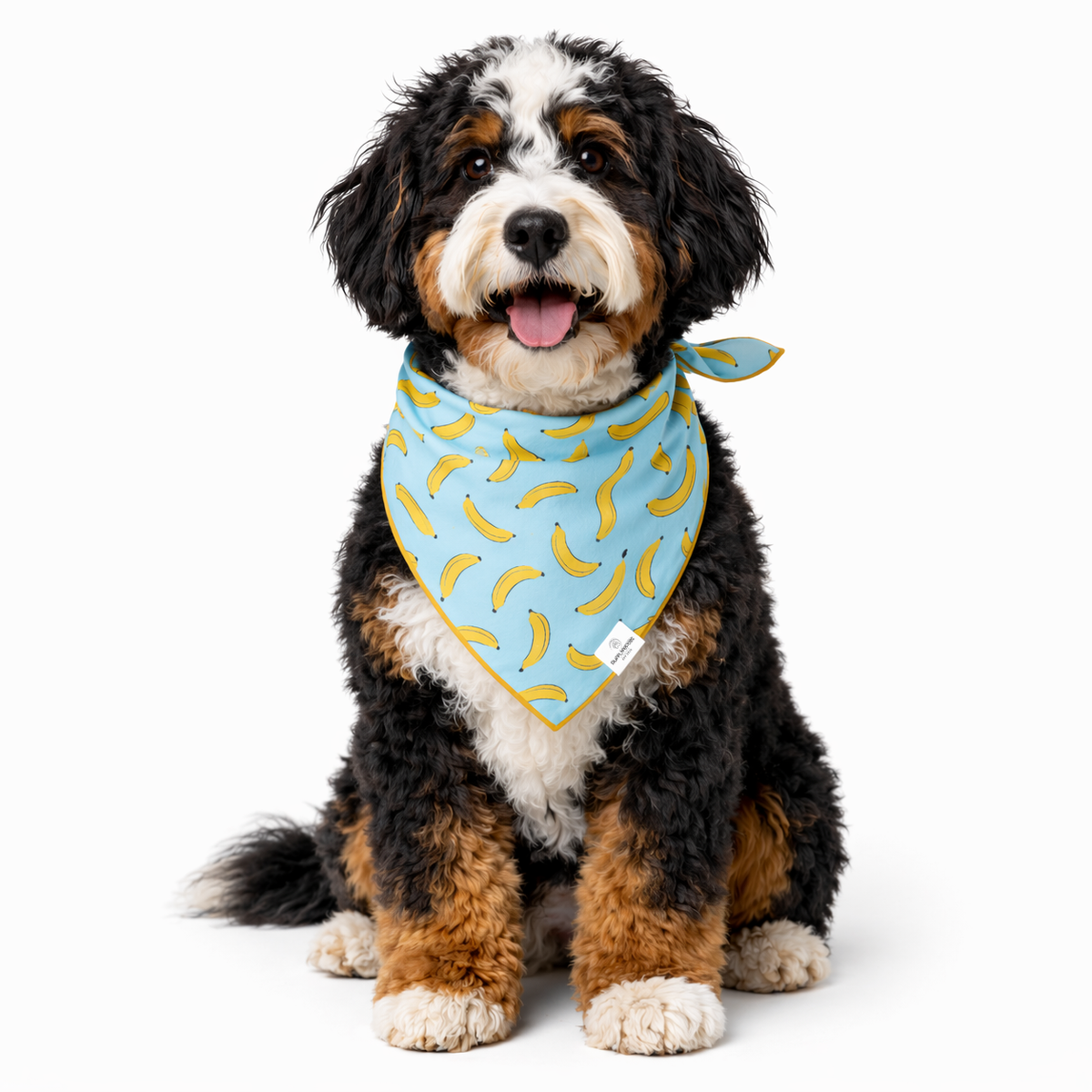 Close-up detail of rufflifepals Bananas dog bandana featuring a playful yellow banana print pattern.