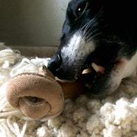 HuggleGroup Huggle-Hide Natural Leather Knotted Bone dog toy showing detailed texture and knotted rope ends