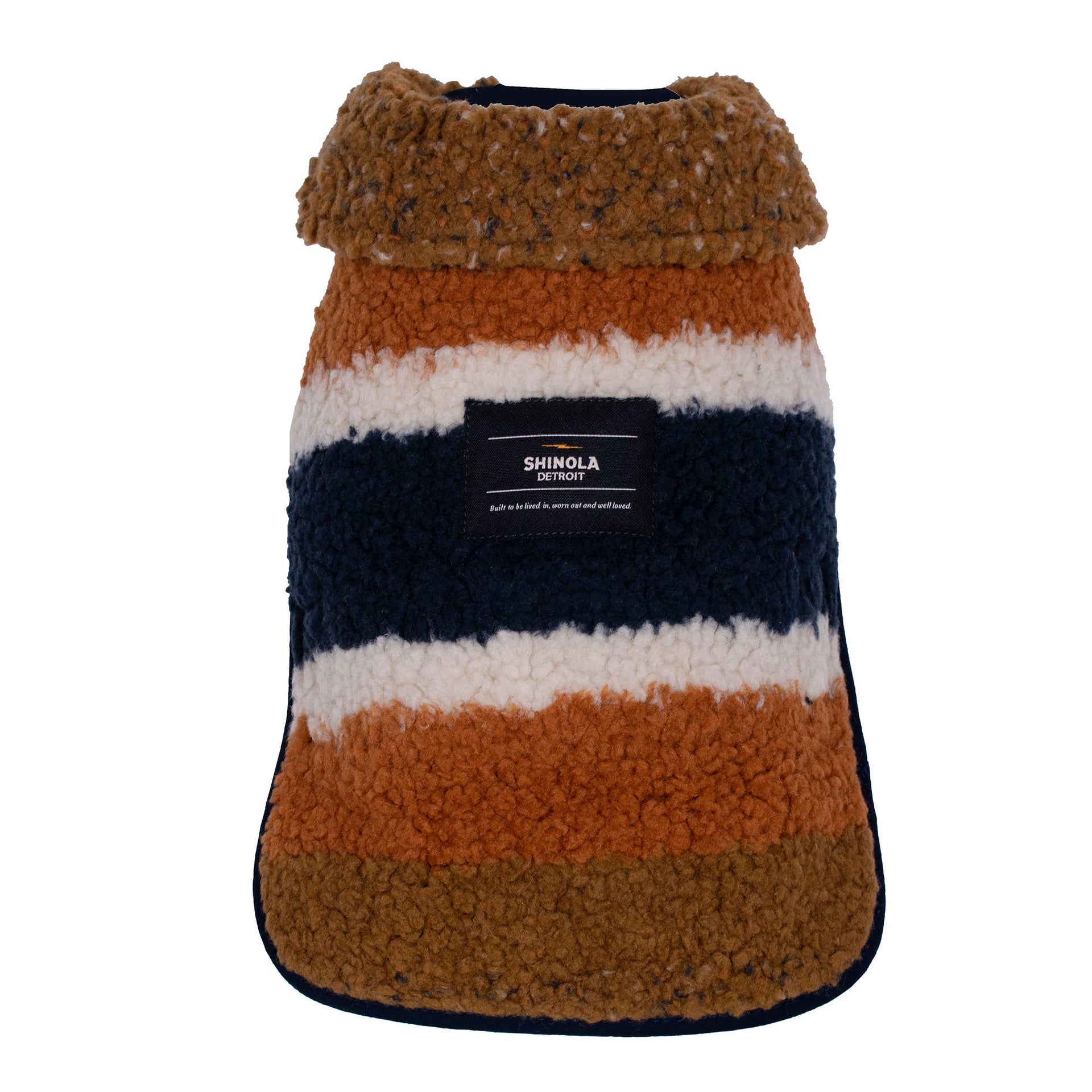 Shinola Pet brown adjustable barn coat showing reversible design and genuine shearling interior detail.