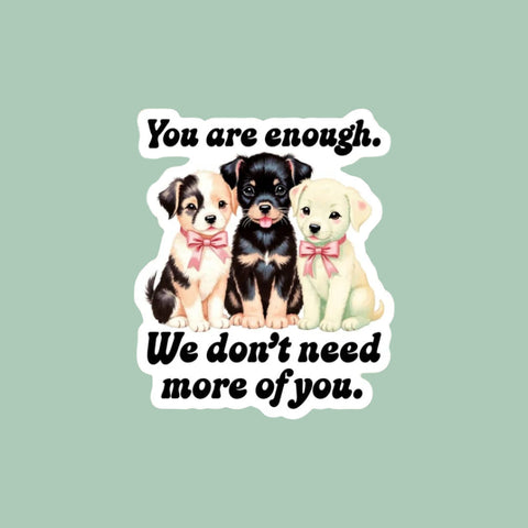 Sticker with three puppies and text on a checkered background