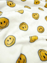 Klippo Pet Happy Face Blanket draped over dog bed showing ultra-plush texture and soft fabric details.