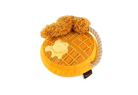 P.L.A.Y. Chicken & Woofles plush dog toy showing detailed syrup drizzles and golden waffle texture from side angle.