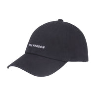 HATPHILE Dog Person hat showing side profile view with embroidered text detail on cotton twill material.