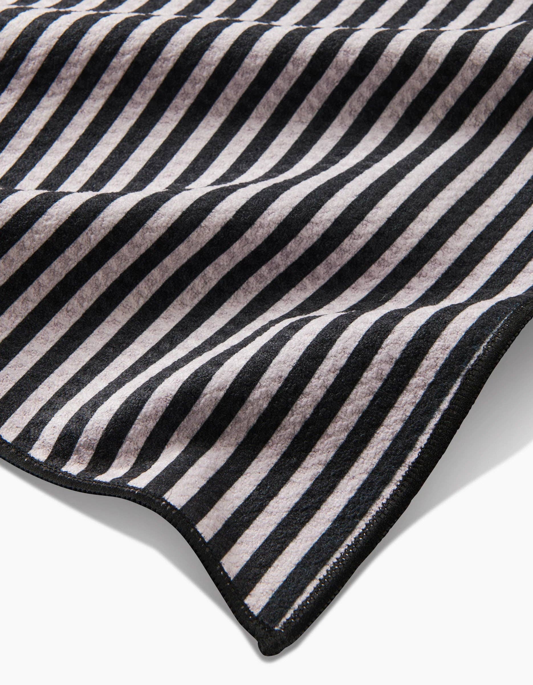 Geometry Good Pup Paw Towel showing textured Geoweave fabric detail and compact square dimensions.