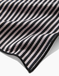 Geometry Good Pup Paw Towel showing textured Geoweave fabric detail and compact square dimensions.