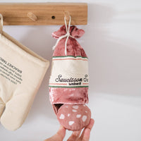 Lambwolf Collective SAUCISSON enrichment toy showing crinkly textured exterior casing and hidden compartments for treats.