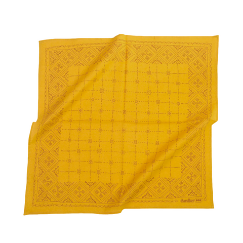 Yellow bandana with a geometric pattern on a white background