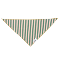 Rufflifepals Cabana Stripe dog bandana worn on a fluffy dog in a relaxed outdoor setting.