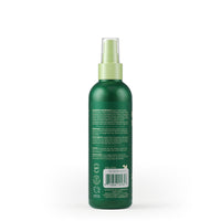 Earth Rated Refresh Mist being sprayed on a dog's coat during grooming routine