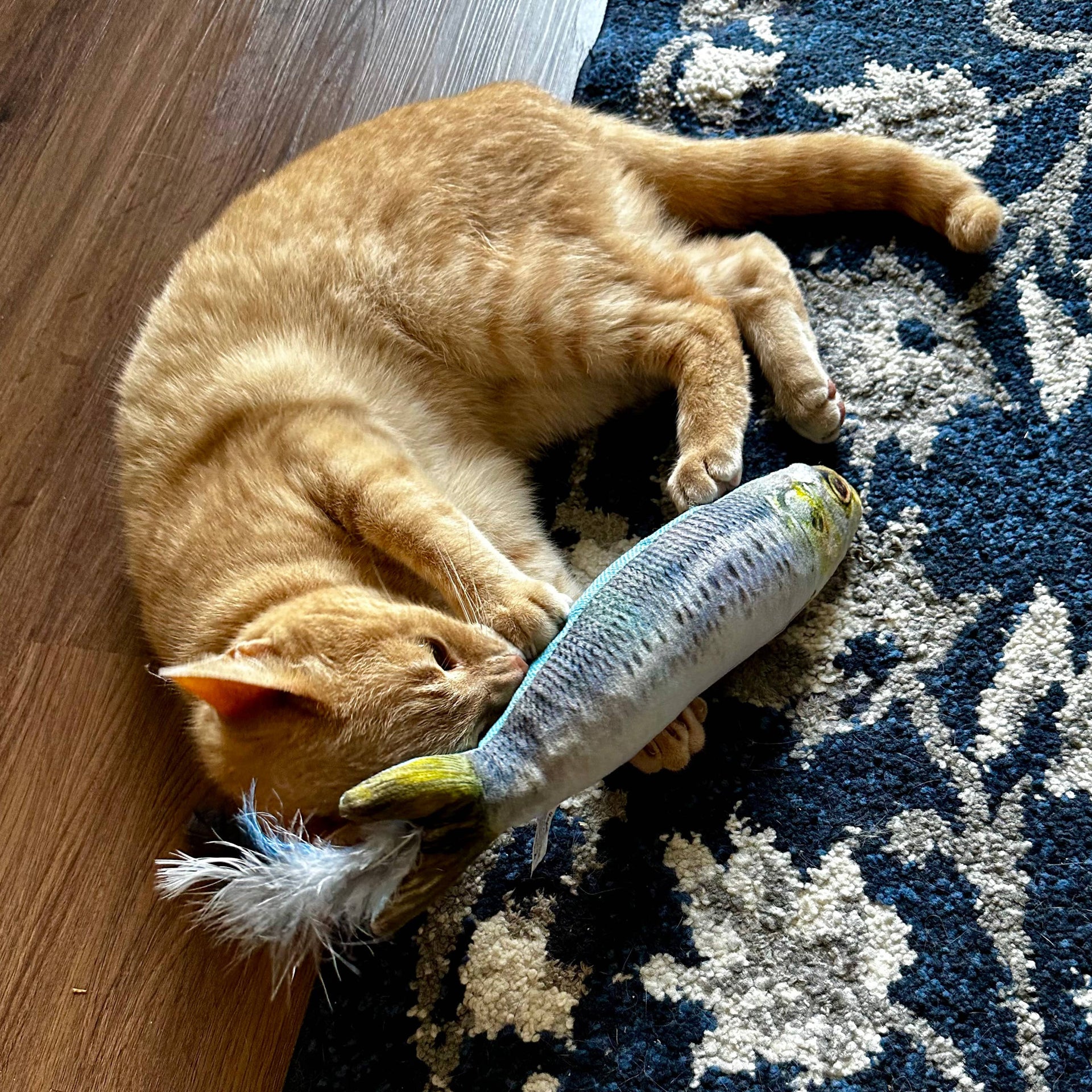 Huxley & Kent Sardine Kicker Cat Toy shown from side angle displaying realistic fish details and plush texture