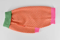 Finnegan's Standard Goods Gingersnap Checker Sweater size chart or packaging detail showing fit and sizing information.