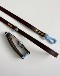 Hund & Shore Mochaccino collar detail showing mocha brown material with light blue accent stitching and hardware.