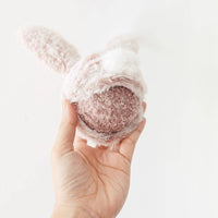 Lambwolf Collective Bunny Pop dog toy showing plush bunny exterior with squeaky ball visible inside opening.