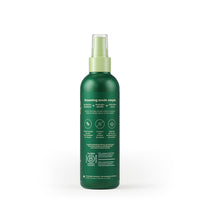 Earth Rated Refresh Mist spray bottle showing product label and key ingredients for dog grooming.
