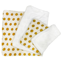 Klippo Pet Happy Face Blanket shown draped over dog bed displaying ultra-plush texture and soft material construction.
