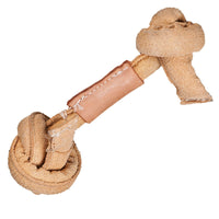 HuggleGroup Huggle-Hide Natural Leather Knotted Bone being chewed by a dog during playtime