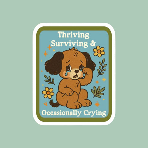 Illustration of a dog with text 'Thriving Surviving & Occasionally Crying' on a pixelated background.