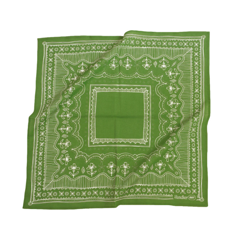Green bandana with white pattern on a white background