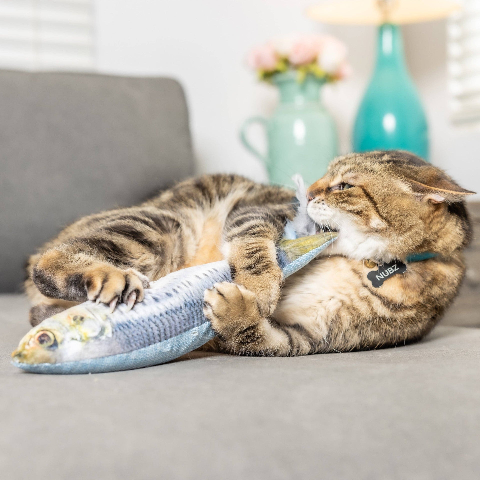 Huxley & Kent Sardine Kicker cat toy showing detailed view of crinkly plush fish design for interactive play.