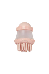 A pink shampoo dispensing brush with soft bristles and a clear soap container, branded with 'maxbone'.