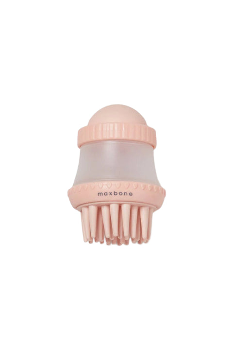 A pink shampoo dispensing brush with soft bristles and a clear soap container, branded with 'maxbone'.