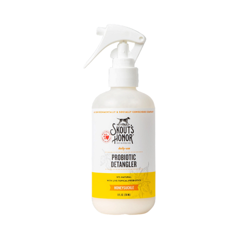 Skout's Honor Honeysuckle Detangler spray bottle with purple and green floral label design.