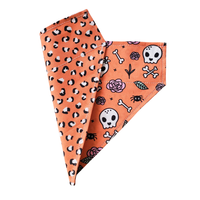 Charlie & the Hound Skull & Roses Reversible Bandana showing detailed view of skull and rose pattern design.