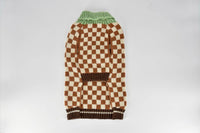 Finnegan's Standard Goods Campfire Check Sweater worn by a dog, shown from a candid lifestyle angle.