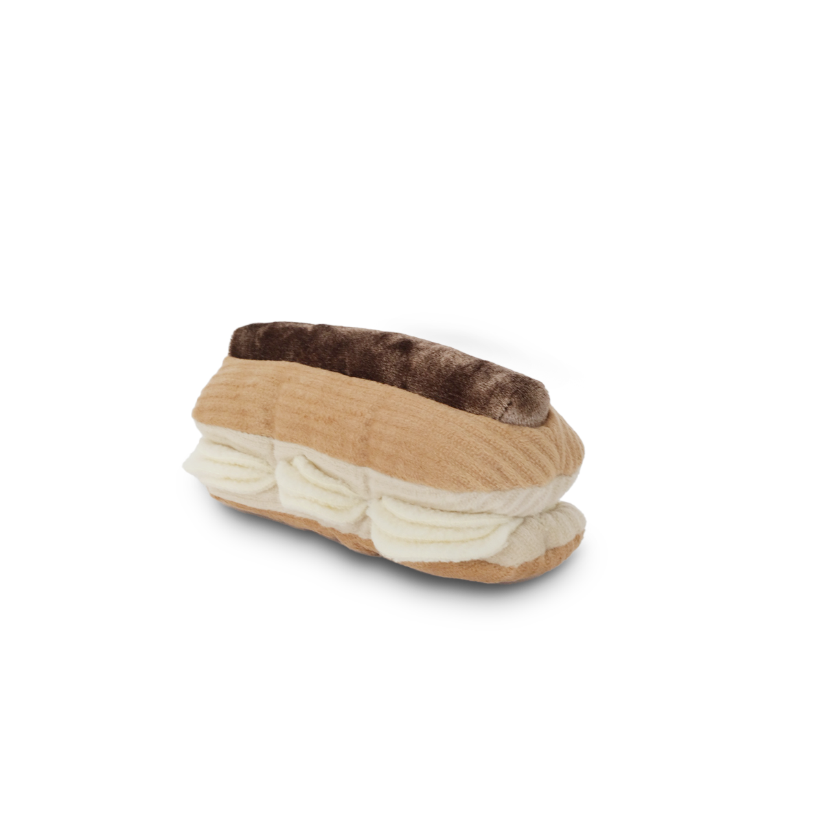 Lambwolf Collective Eclair enrichment dog toy with textured cream-colored flaps and treat-dispensing pockets for mental stimulation.