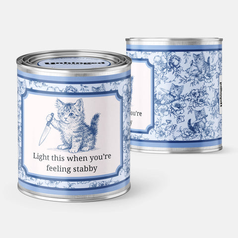 Close-up detail of Unhinged Candles Light This When You Feel Stabby Kitten Soy Candle label and texture.