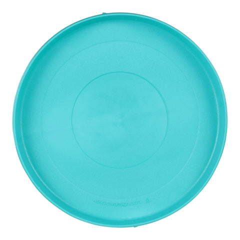 West Paw Zisc teal frisbee toy shown from side angle displaying curved ergonomic edges and grippy texture.
