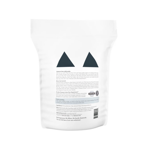BoxieCat Pro probiotic cat litter being poured from container showing granule texture and consistency