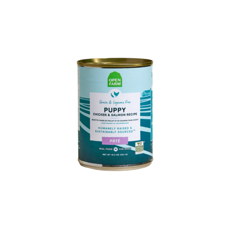 Open Farm Puppy Chicken & Salmon Pâté wet dog food can with colorful label featuring puppy graphics.