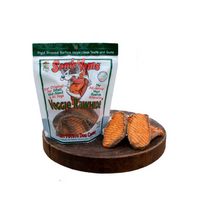 Bag of Sam's Yams Veggie Rawhide with two pieces on a wooden board outdoors.