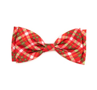 Red and green plaid bow tie on a white background