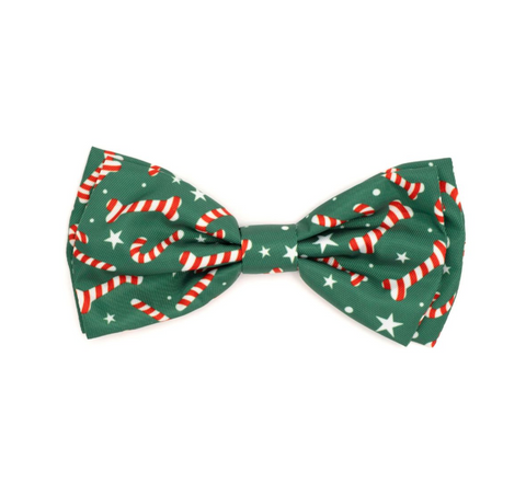 Green bow tie with candy cane pattern on a white background