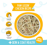 Weruva Paw Lickin' Chicken wet dog food can showing ingredient details and nutritional information panel.