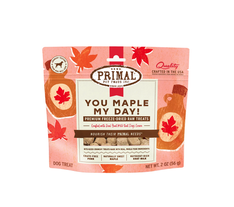 Primal freeze-dried pork, maple, and goat milk dog treats package showing brand logo and product details.