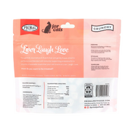Primal freeze-dried pork liver cat treats spilling from opened package showing dark brown treat pieces