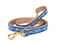 Up Country Aztec dog collar displayed on wooden surface showing detailed geometric Southwestern pattern design.