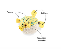 P.L.A.Y. Ocean Buddies puffer fish toy showing textured squeaker ball inside after outer plush layer removal.